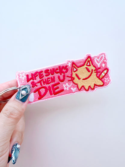Life Sucks Embroidered Jet Tag